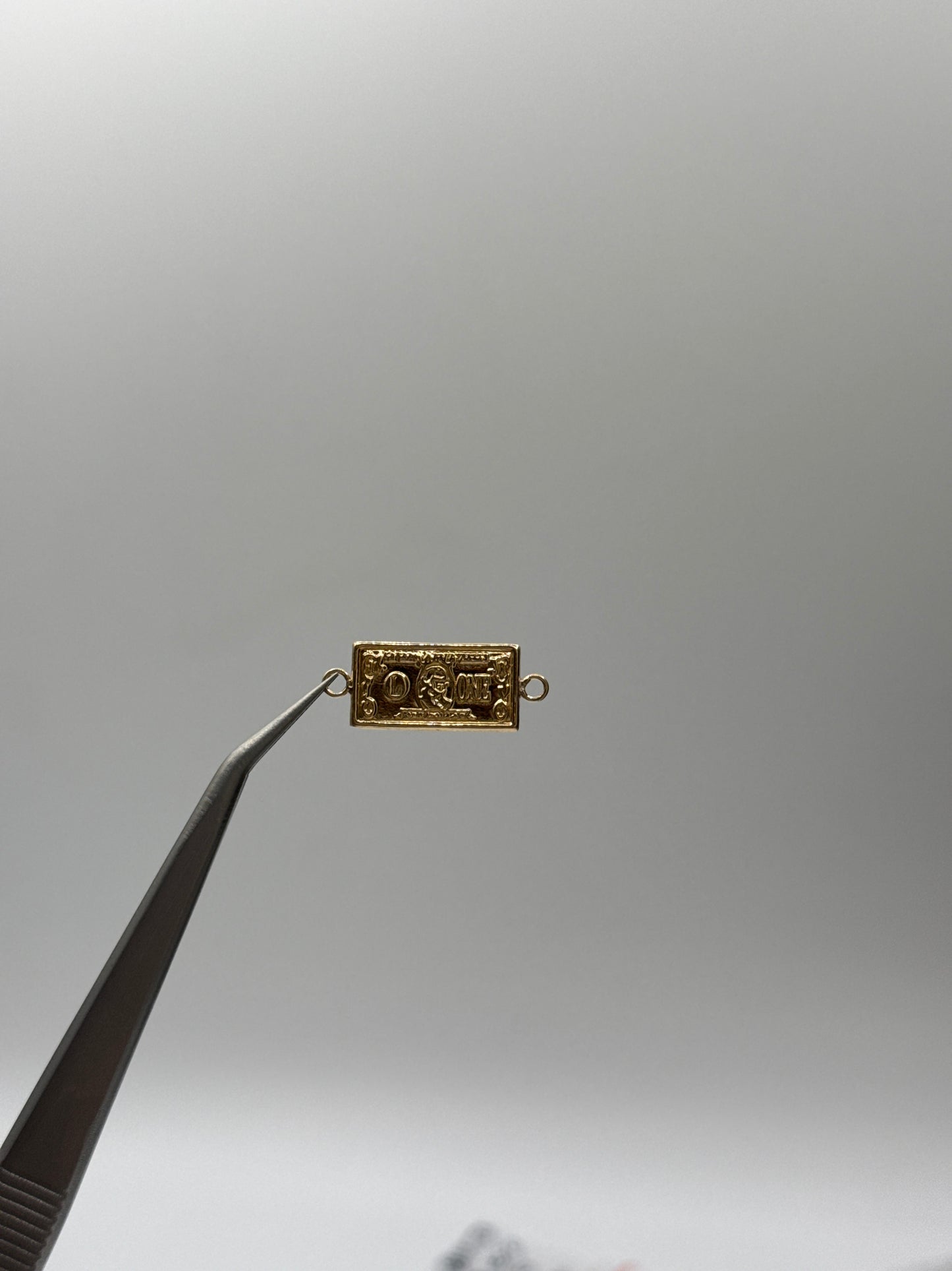 Herraje dolar Oro amarillo 18k 0,82 Gr / 0,86 Cm