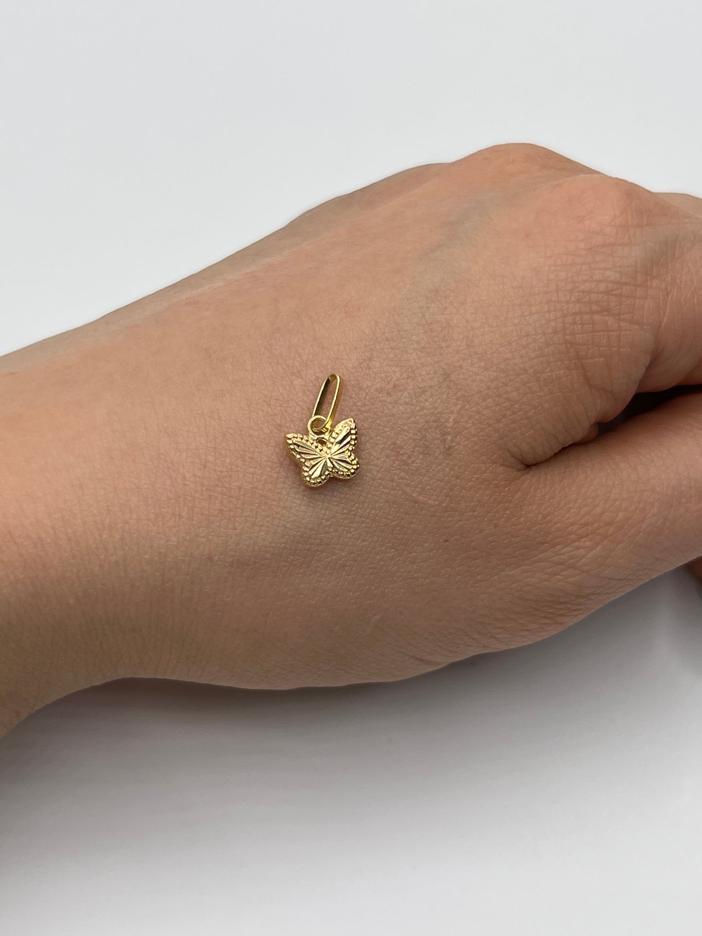Dije Mariposa Diamantada Oro amarillo 18k 0,34 Gr / 8,20 mm / 0,8 Cm