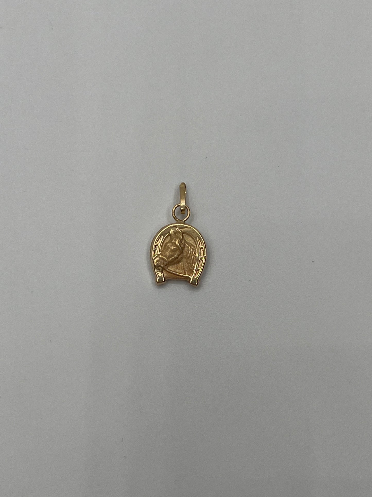 Dije caballo Oro amarillo 18k 0,53 Gr / 9 mm / 1,1 Cm