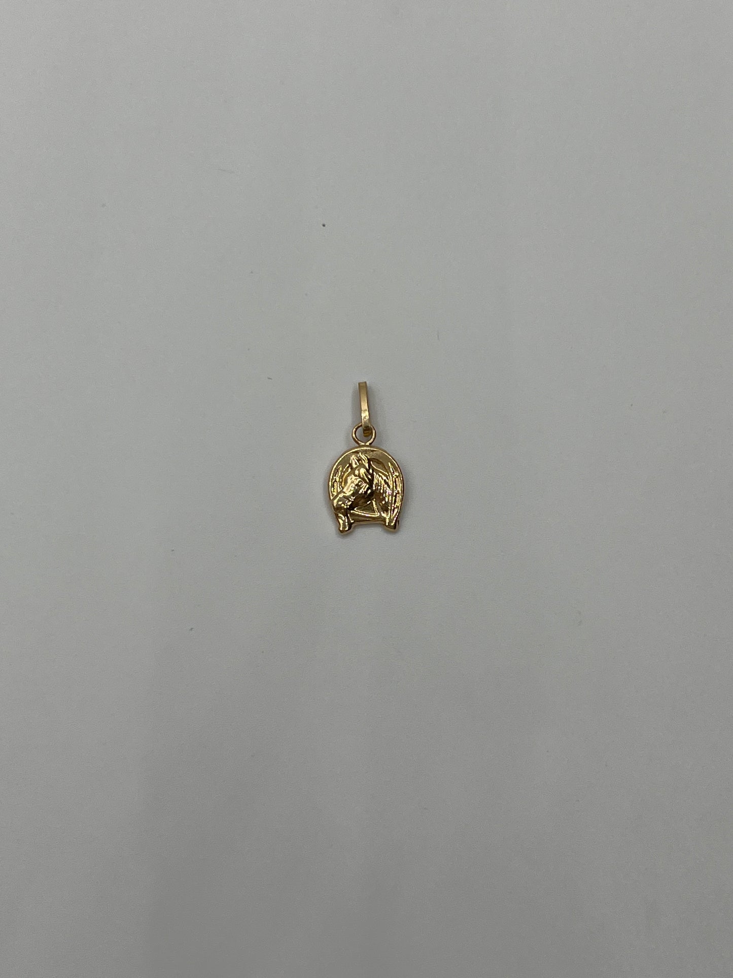 Dije Caballo Oro amarillo 18k 0,58 Gr / 9 mm / 1,1 Cm