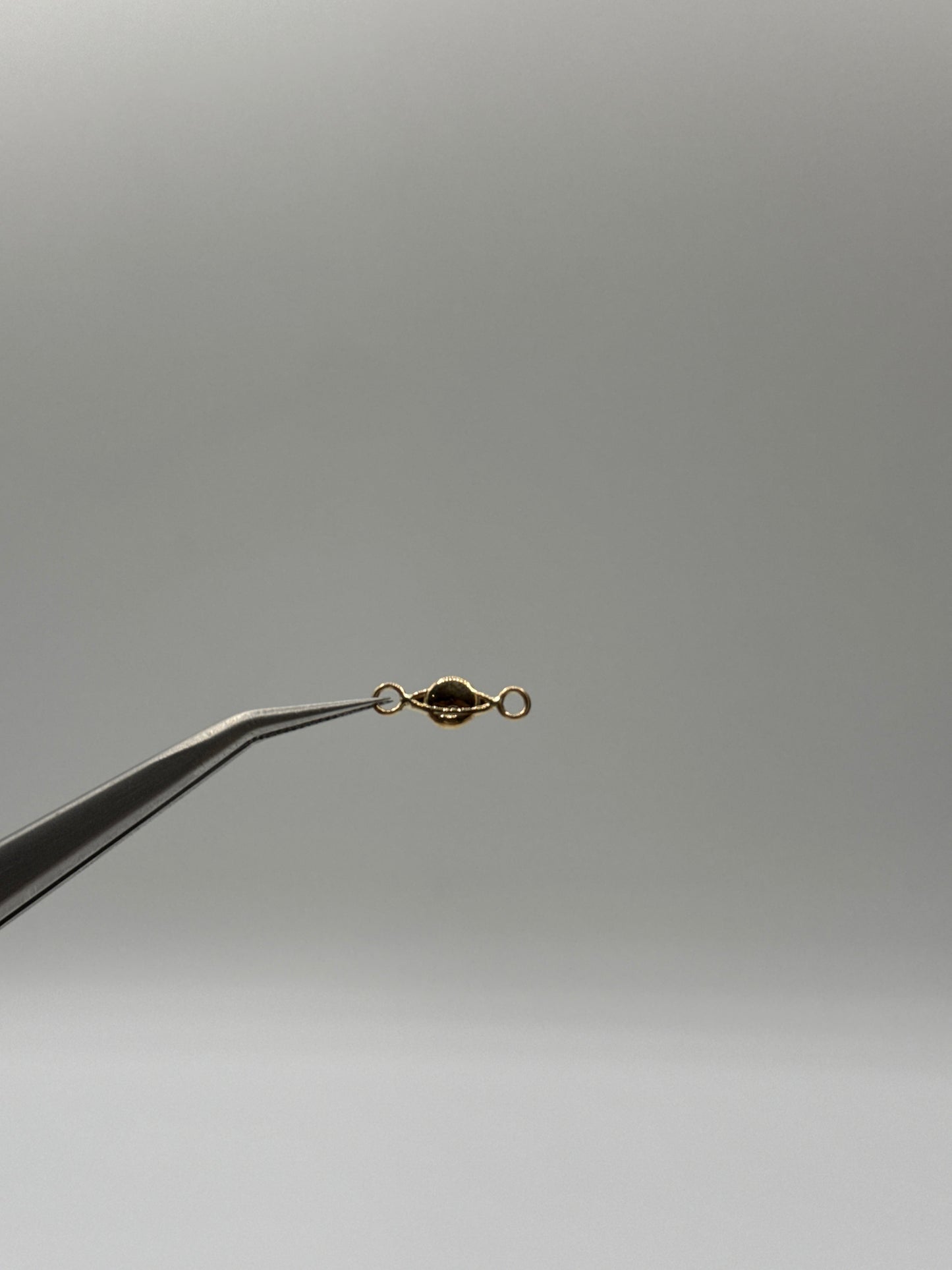 Herraje planeta Saturno Oro amarillo 18k 0,17 Gr / 1,4 Cm