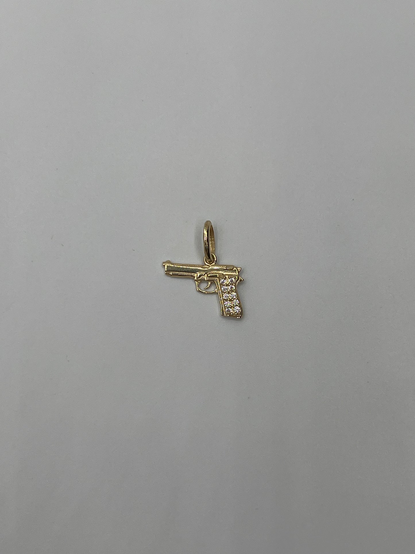 Dije pistola circon blanco Oro amarillo 18k 1,06 Gr / 12,70 mm / 1 Cm