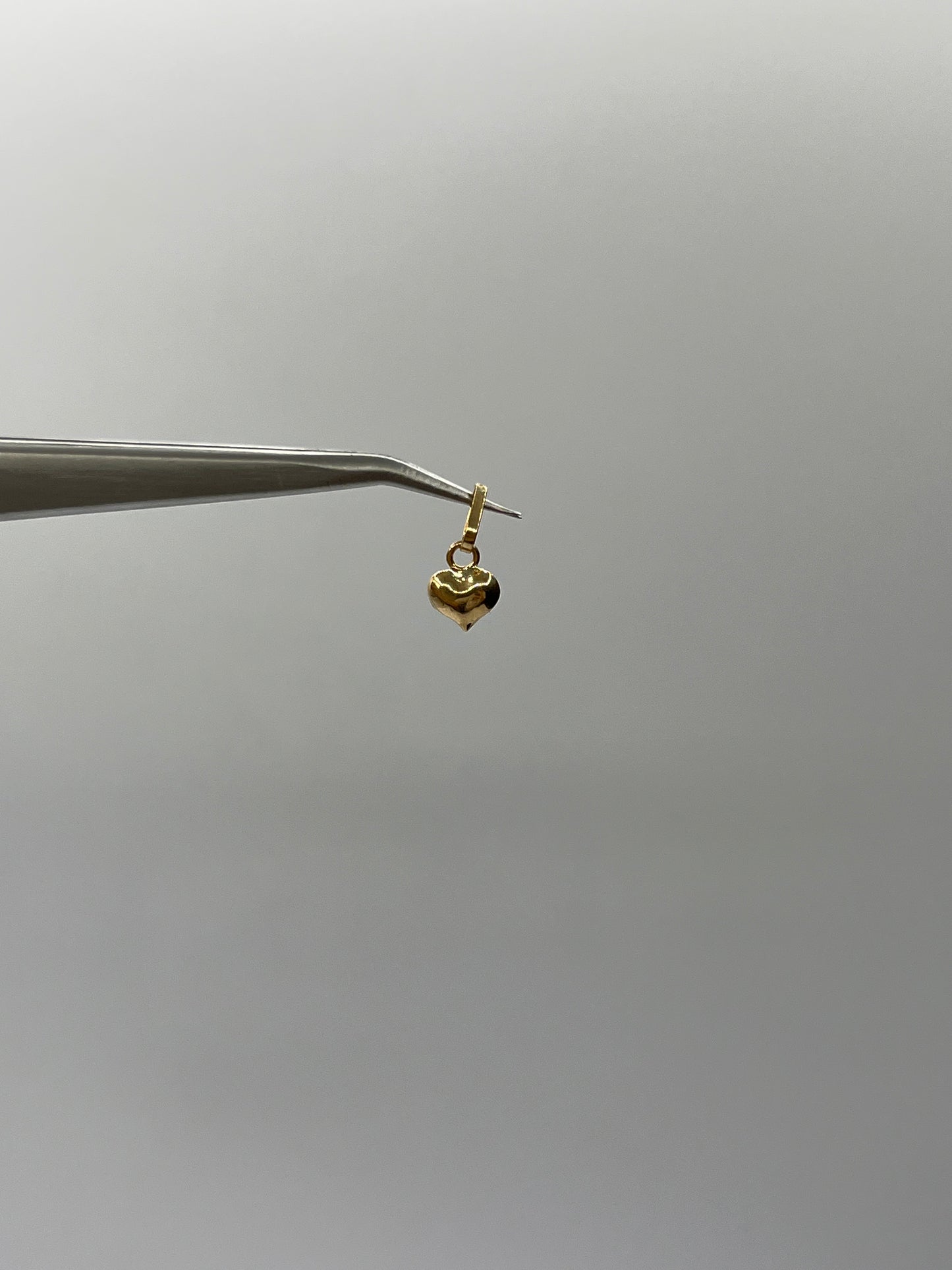 Dije Corazon Liso Oro amarillo 18k 0,25 Gr / 6,60 mm / 0,8 Cm