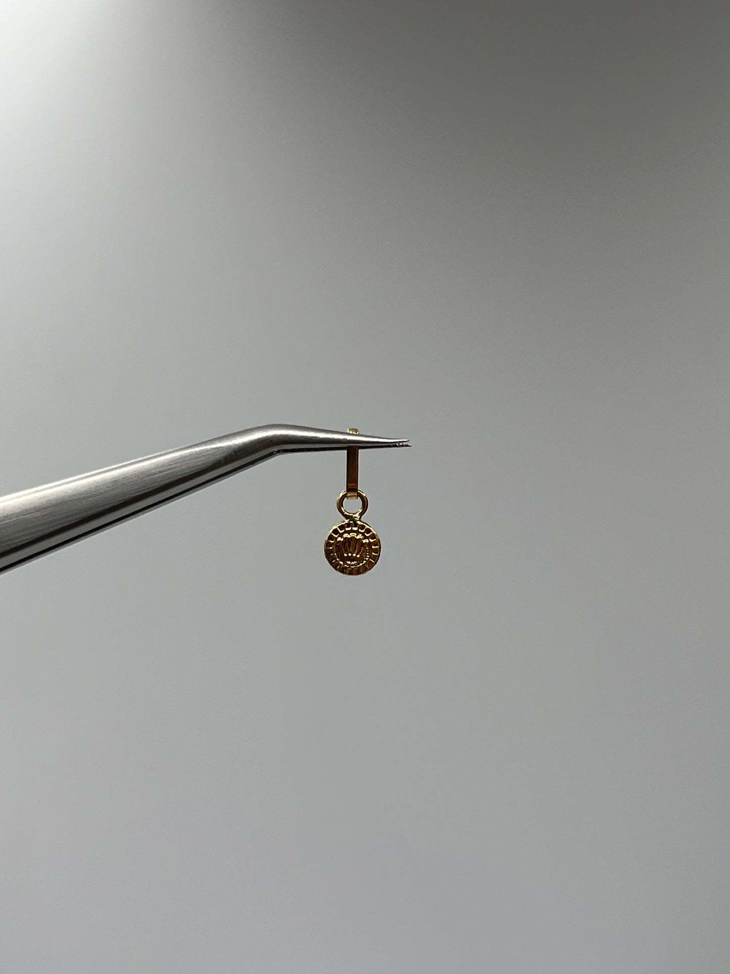 Dije RX Oro amarillo 18k 0,23 Gr / 5,5 mm / 0,5 Cm