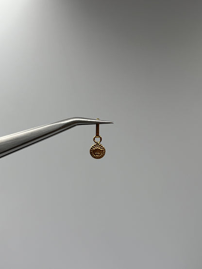 Dije RX Oro amarillo 18k 0,23 Gr / 5,5 mm / 0,5 Cm