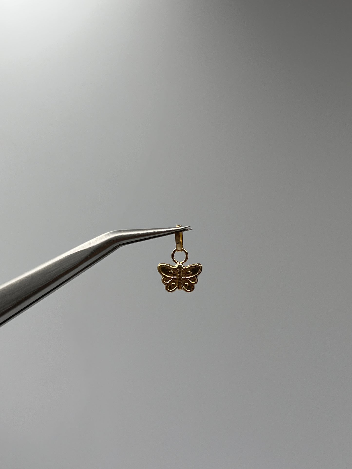 Dije Mariposa Oro amarillo 18k 0,25 Gr / 7,6 mm / 0,4 Cm