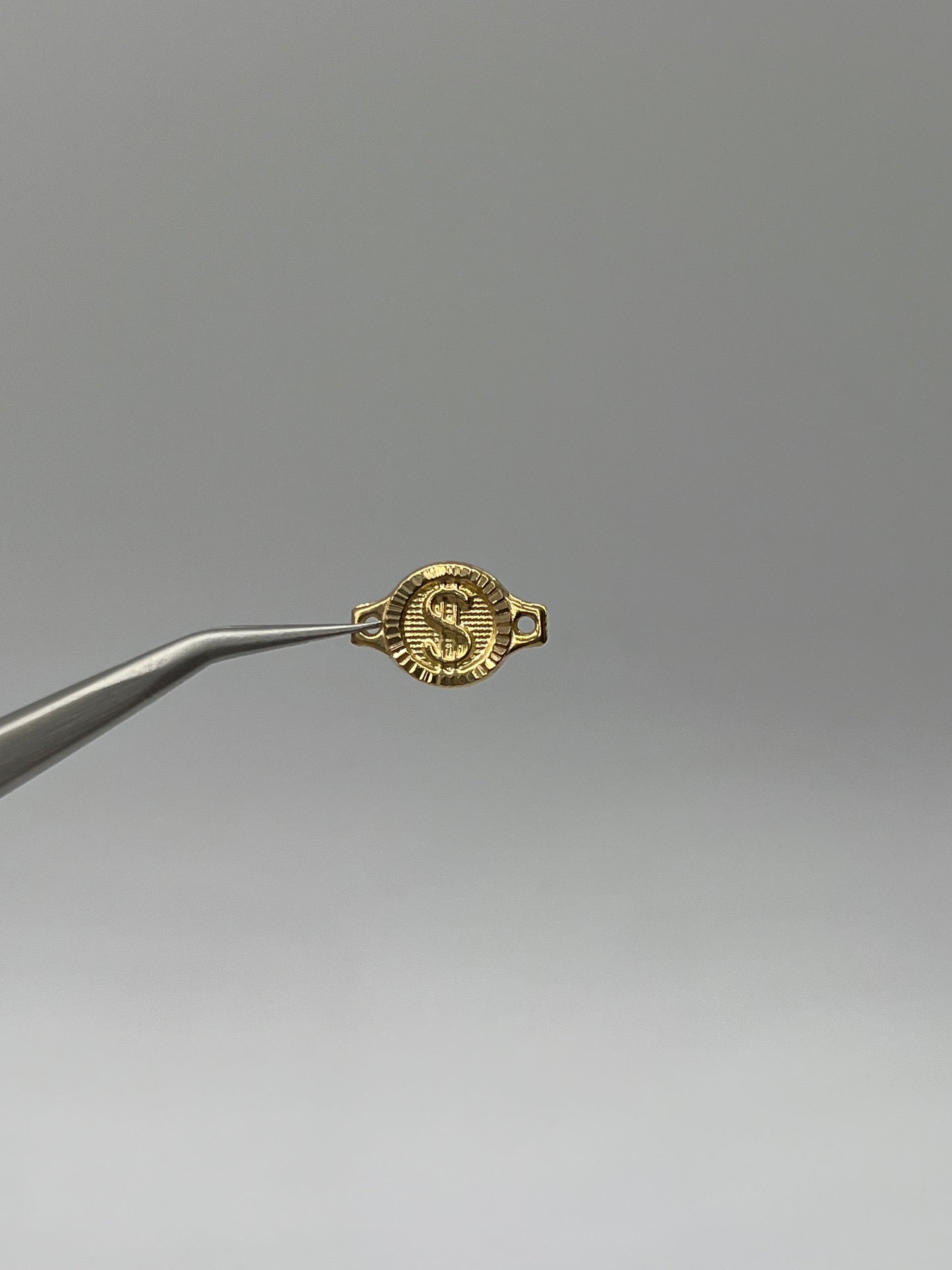 Herraje Signo Peso Oro amarillo 18k 0,61 Gr / 1 Cm