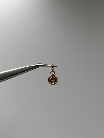 Dije RX Oro amarillo 18k 0,29 Gr / 7 mm / 0,7 Cm
