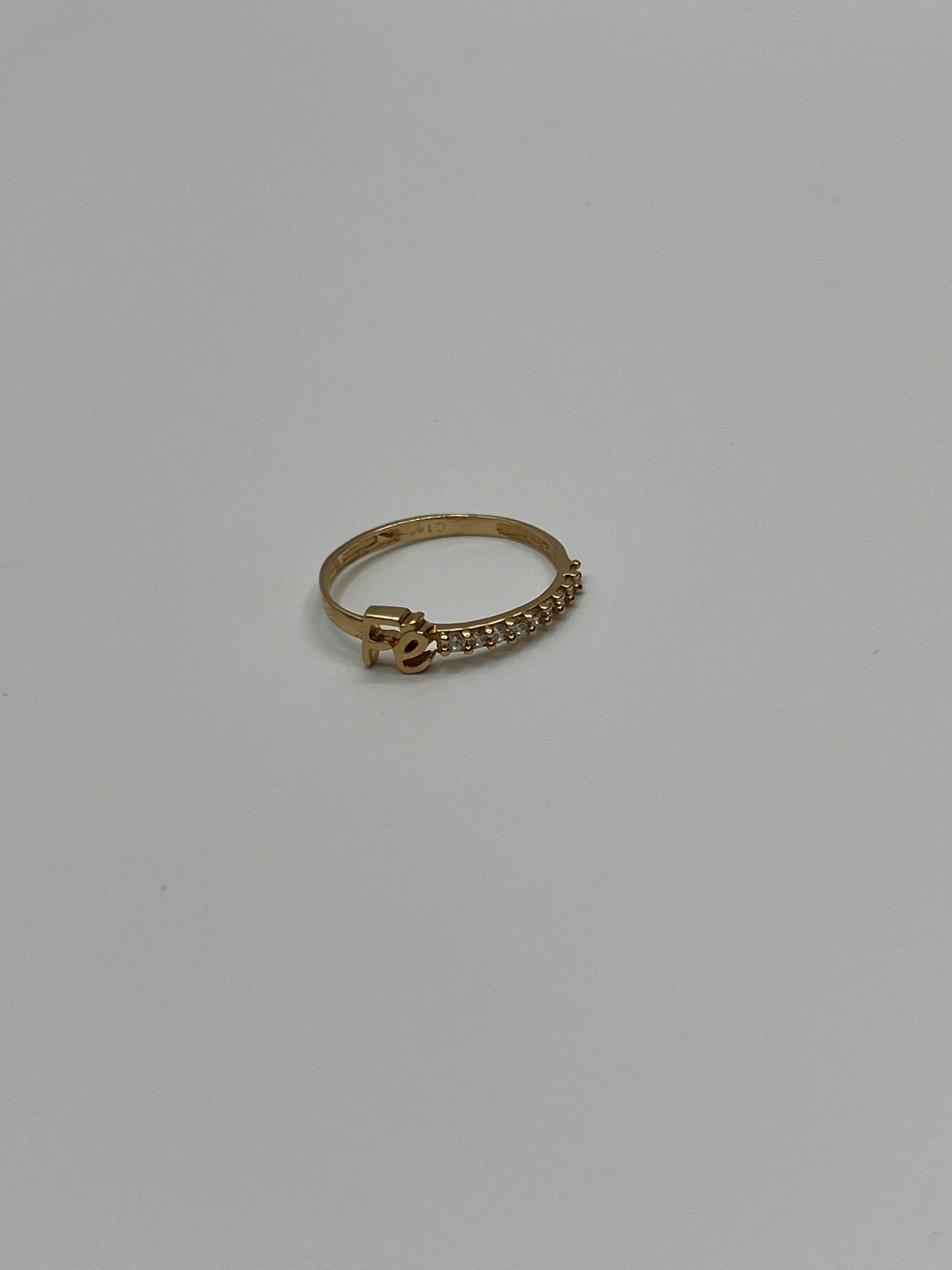 Anillo fé circon blanco Oro amarillo 18k / Talla 6 3/4 / 1,37 Gr / 4,56 mm