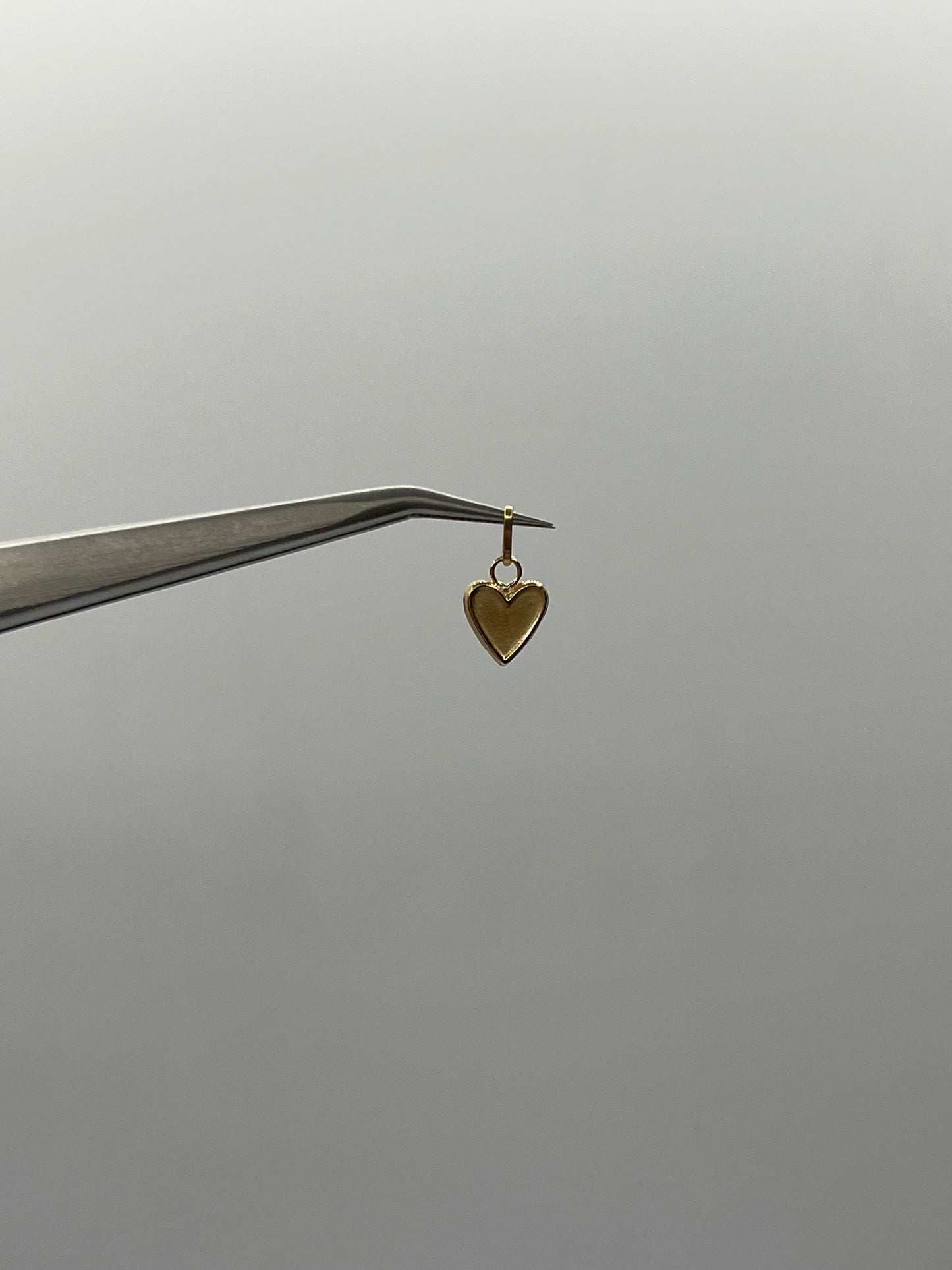 Dije corazón Oro amarillo 18k 0,34 Gr / 7 mm / 1 Cm
