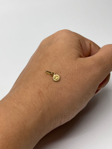 Dije RX Oro amarillo 18k 0,23 Gr / 5,5 mm / 0,5 Cm